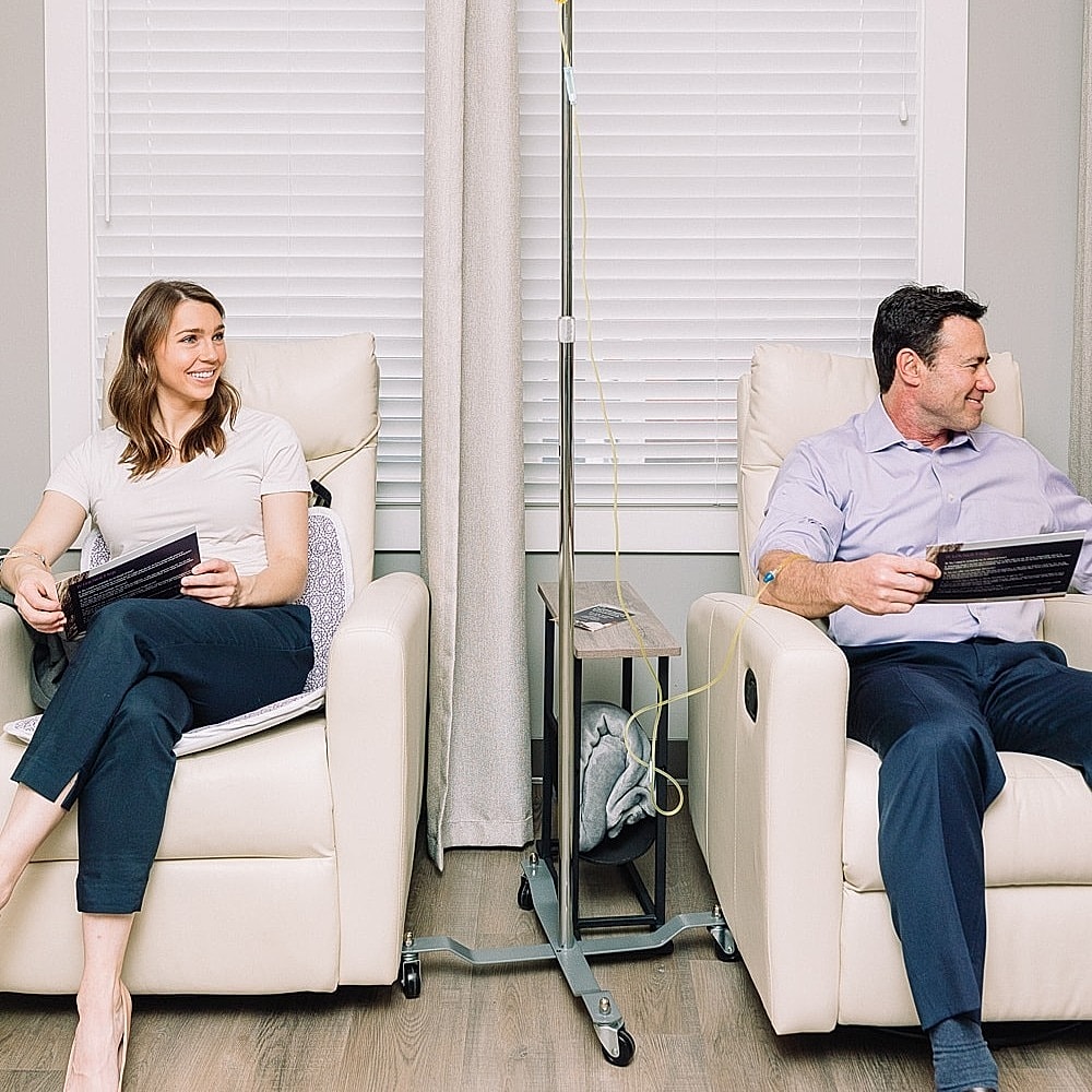 Patients receiving IV therapy in comfortable chairs.