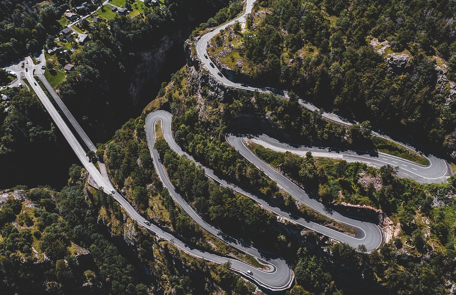 Winding road through lush, mountainous landscape.