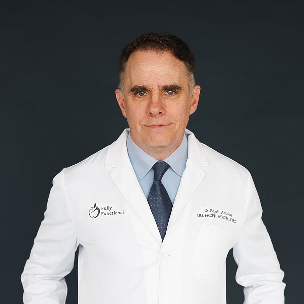 Doctor in a white coat against a dark background