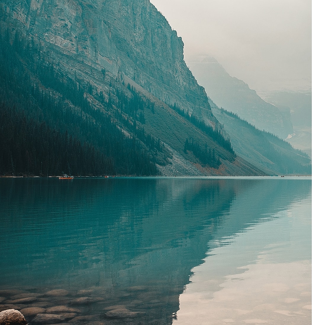 Serene lake surrounded by majestic mountains.