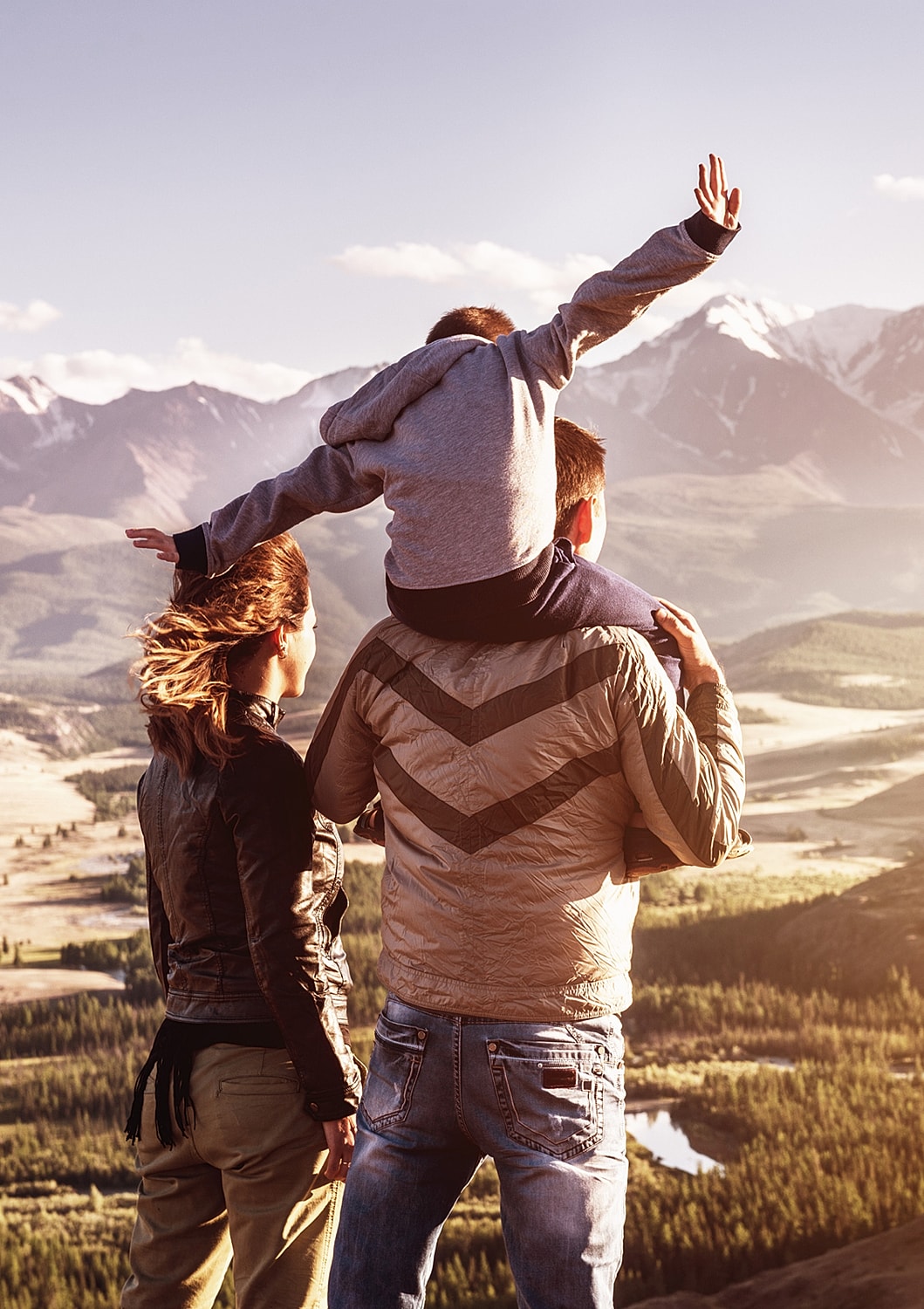 Family enjoying a scenic mountain view together.