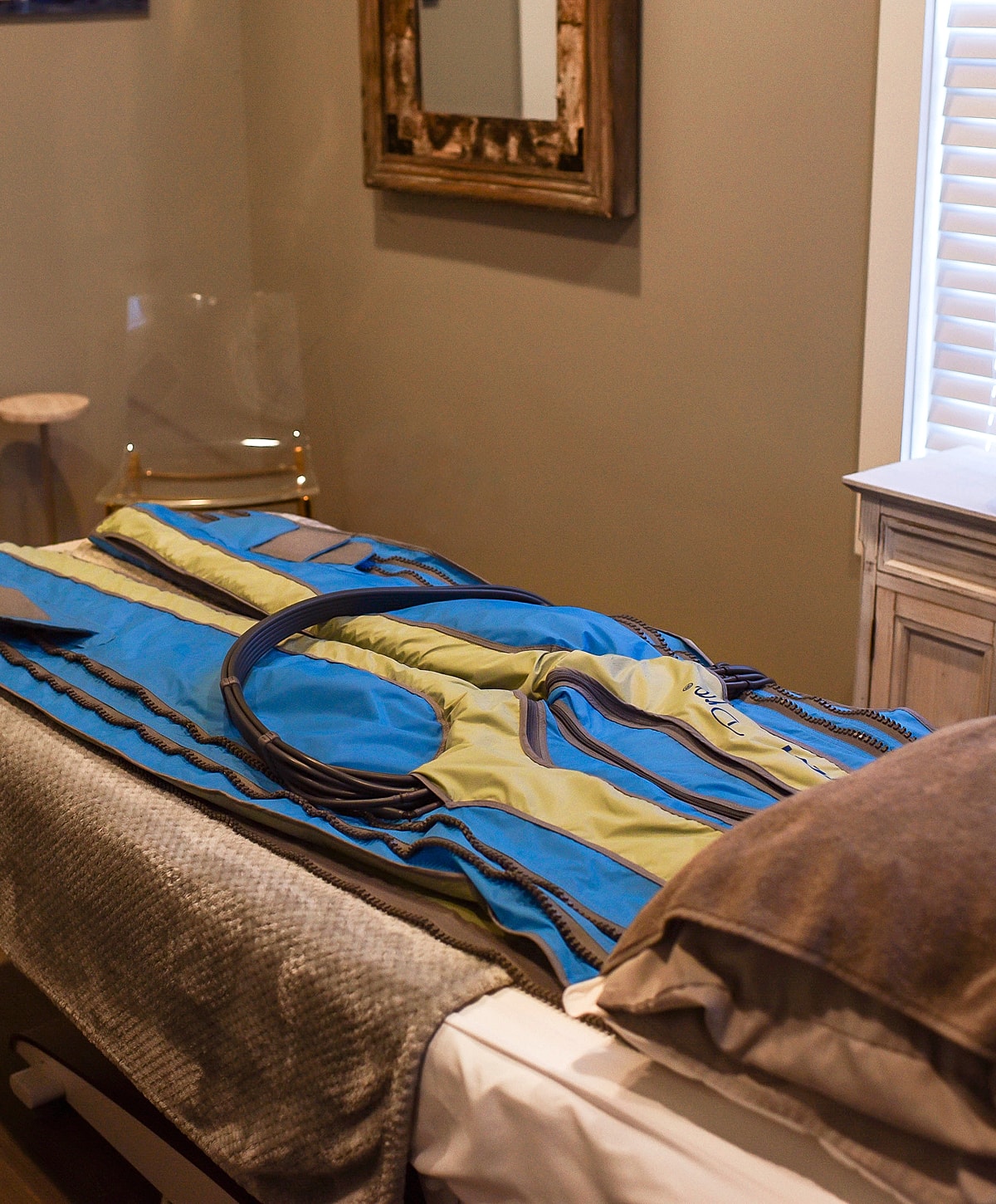 Compression therapy suit on a treatment table
