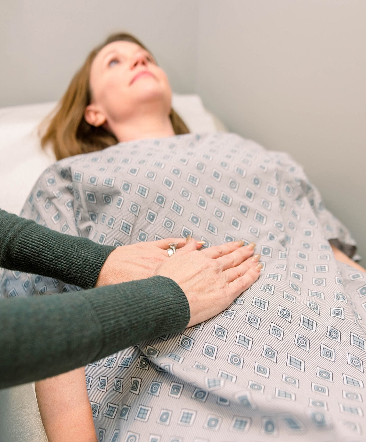 Patient receiving a medical examination or treatment.