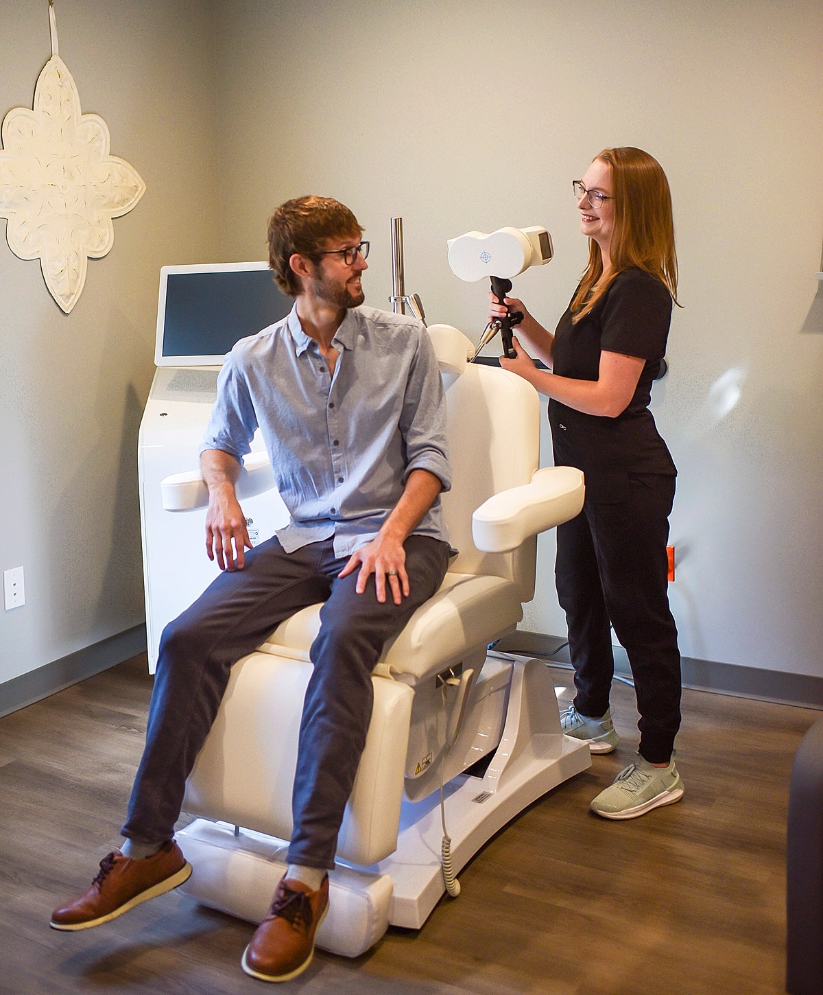 Patient receiving eye exam in modern clinic