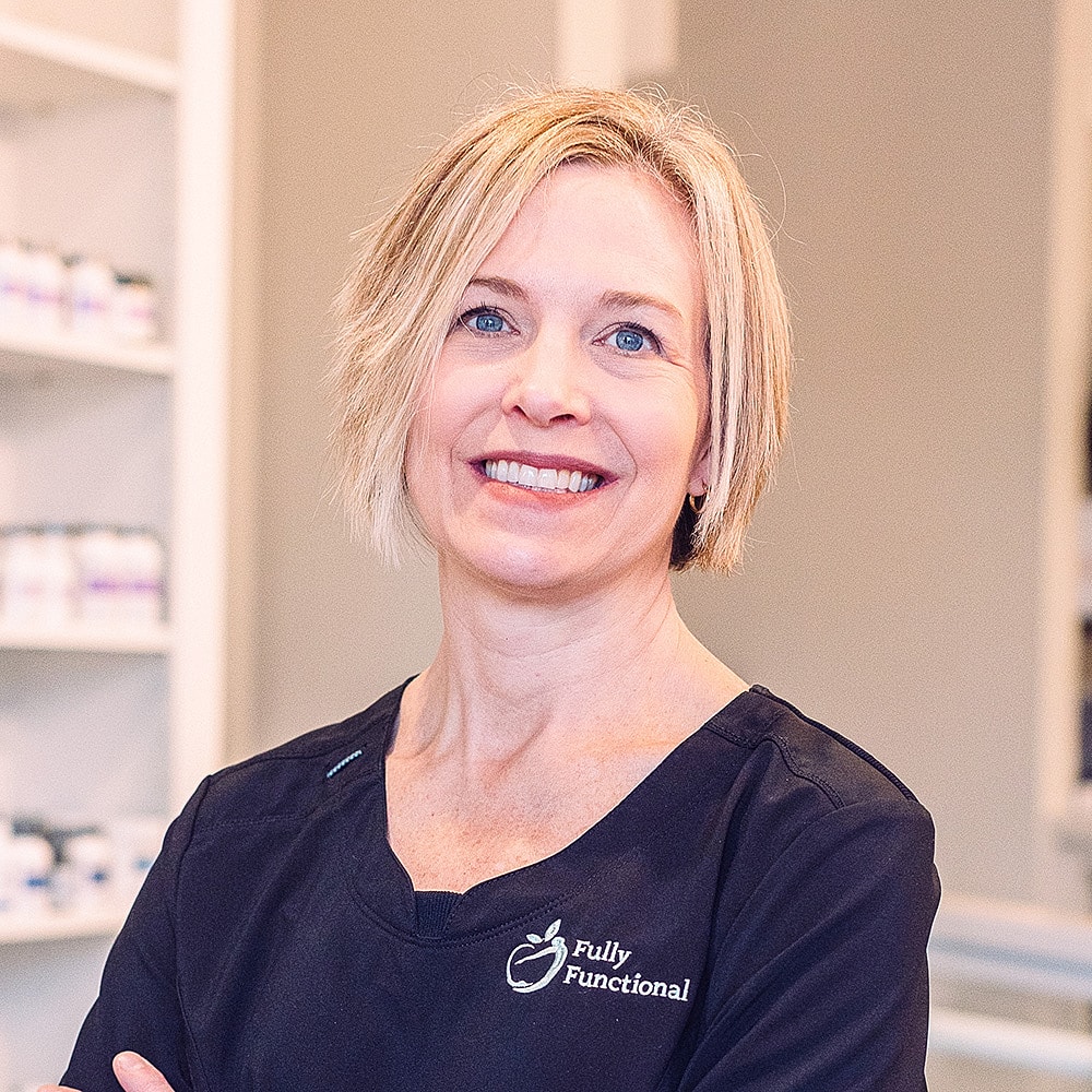 Smiling professional in a healthcare setting.