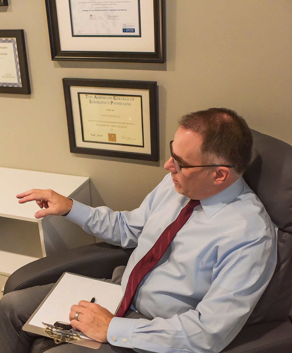 Doctor discussing in an office setting.