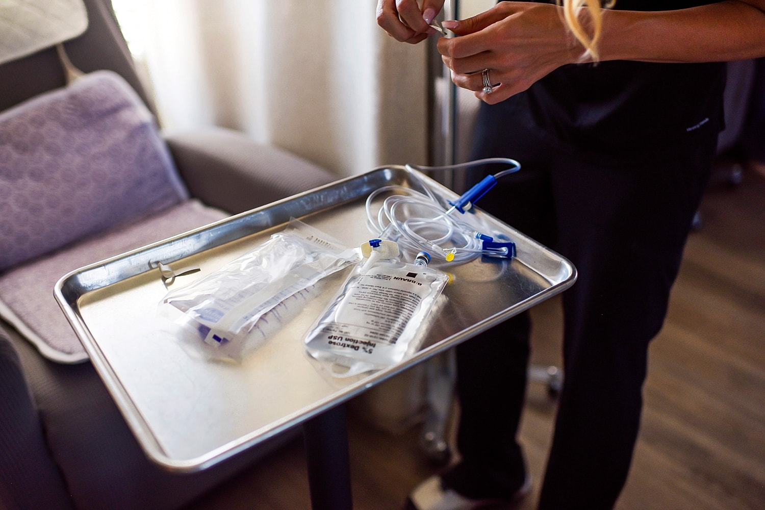 Medical supplies on a tray in a treatment setting.