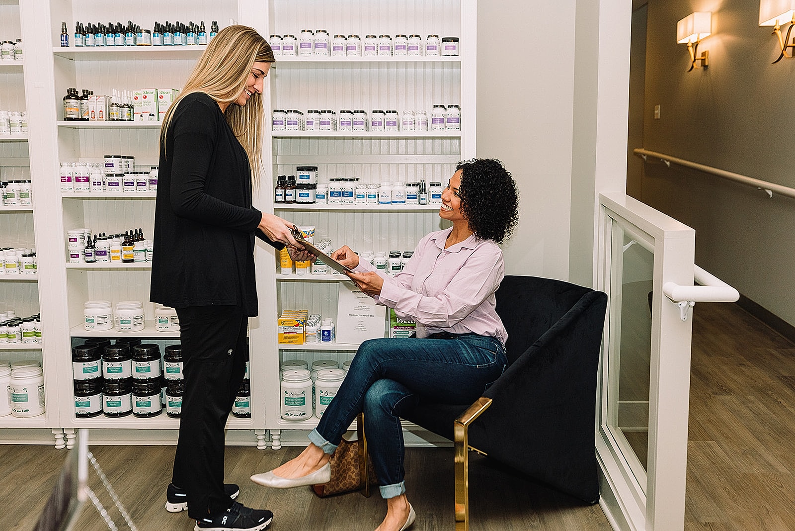 Customer consultation in wellness store setting.