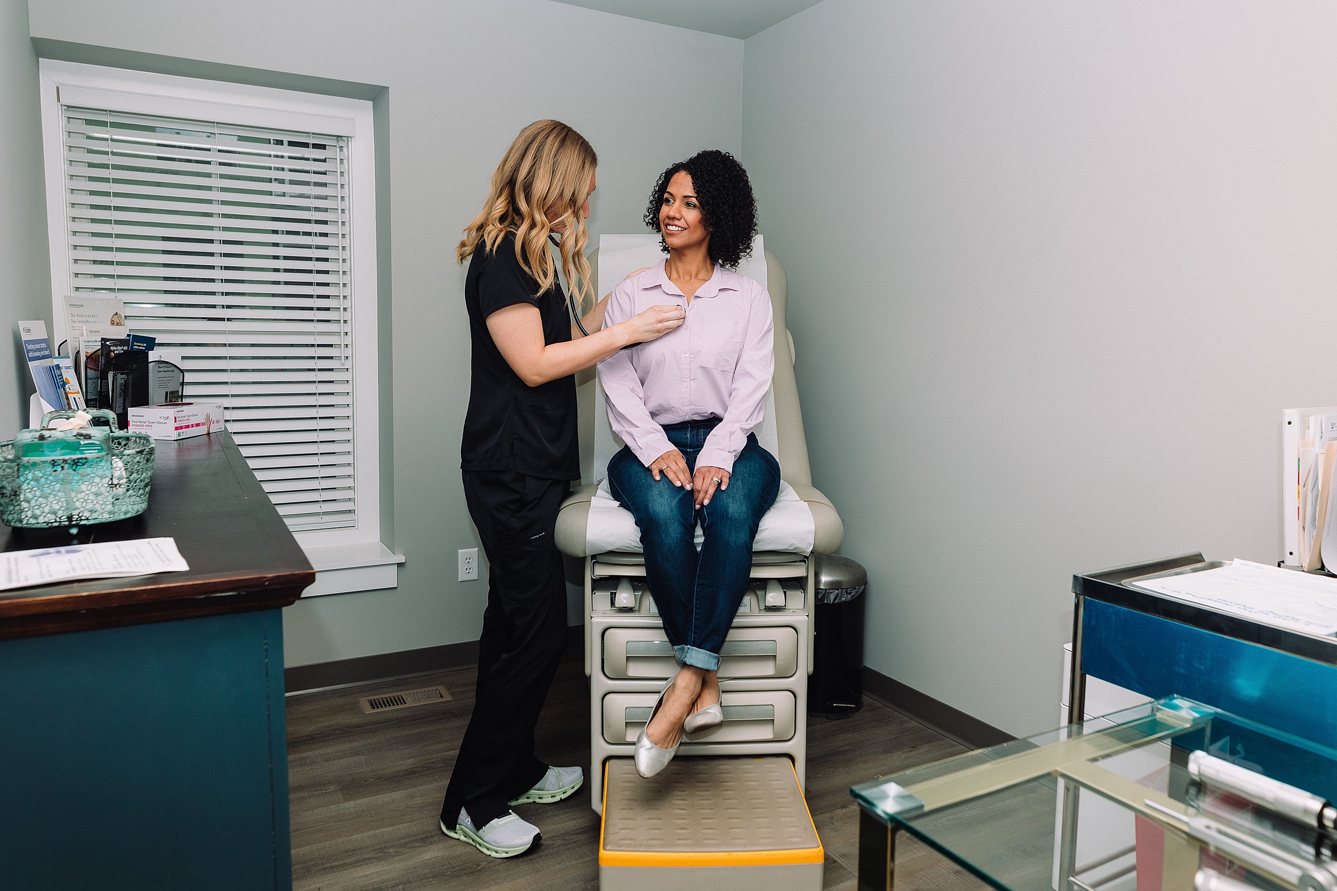 Patient receiving care in medical office setting.