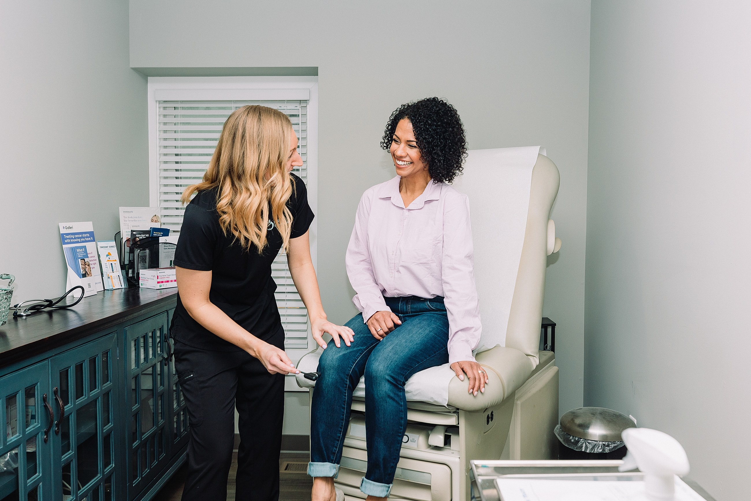 Patient consultation in a medical office setting.