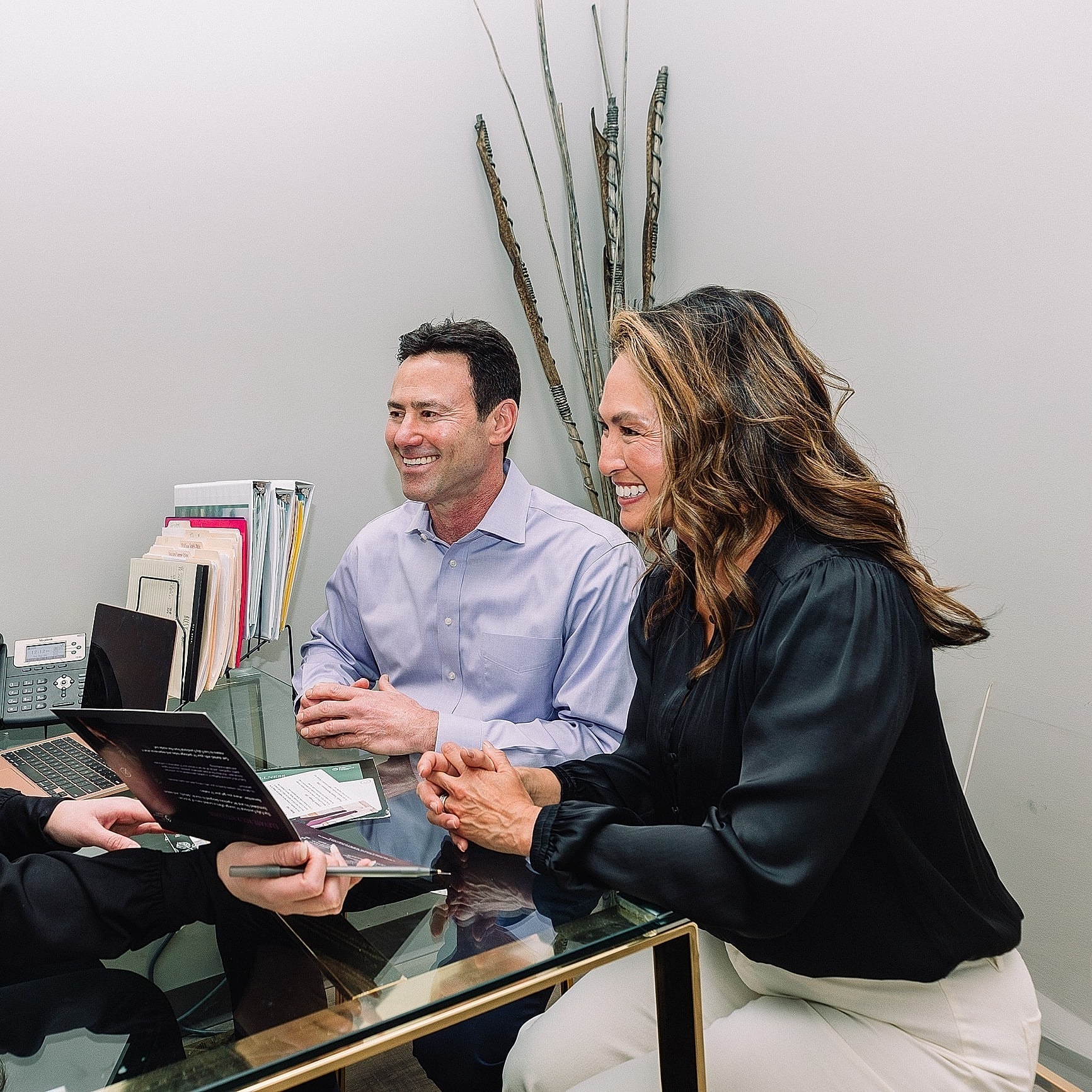 Business meeting with smiling professionals in office.