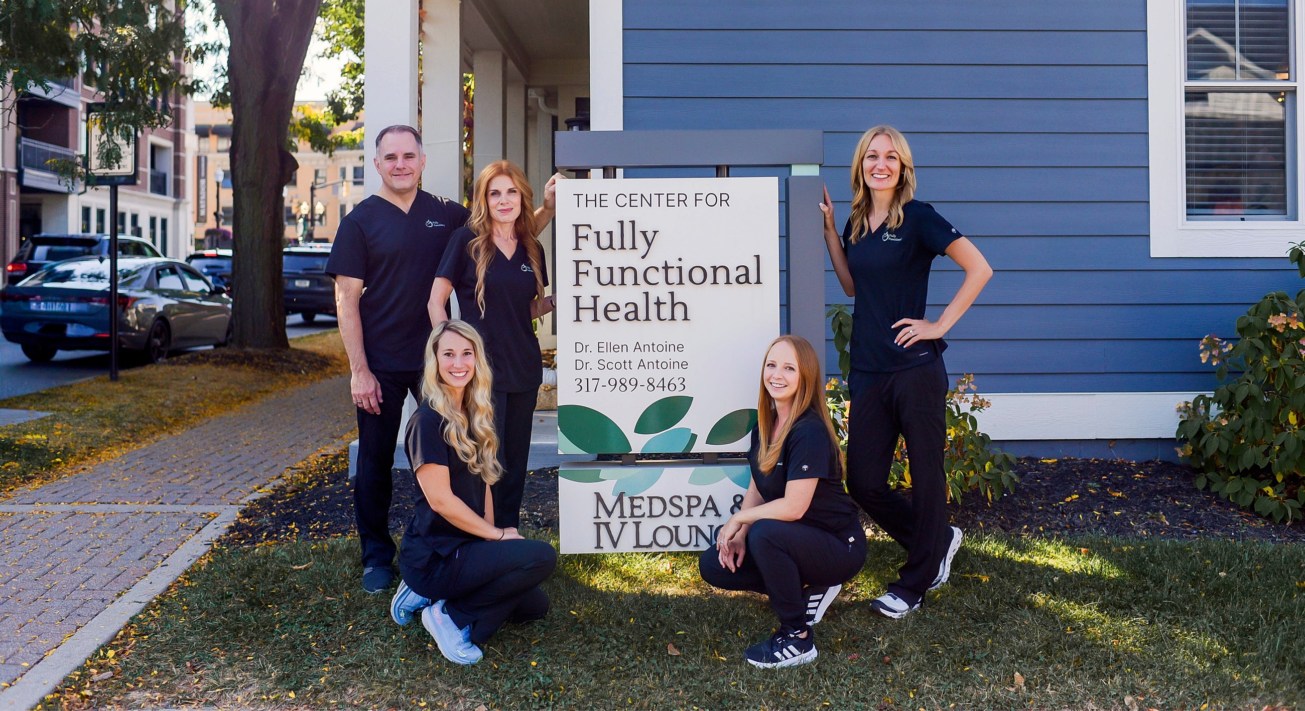 Healthcare team in front of their clinic.