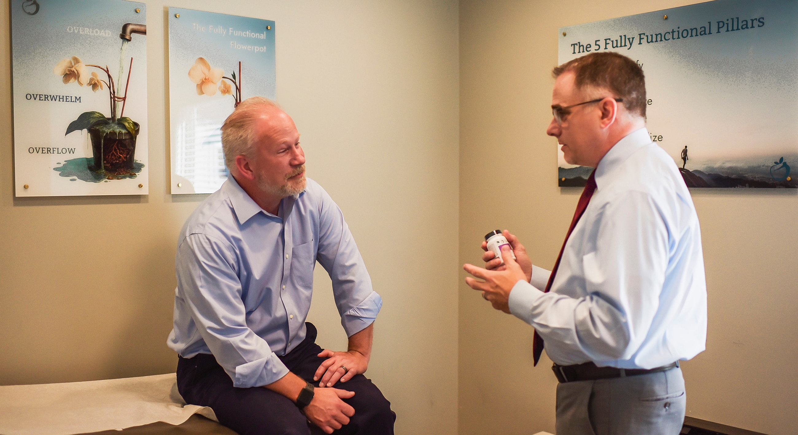 functional medicine doctor consulting with a patient model about headaches and migraines