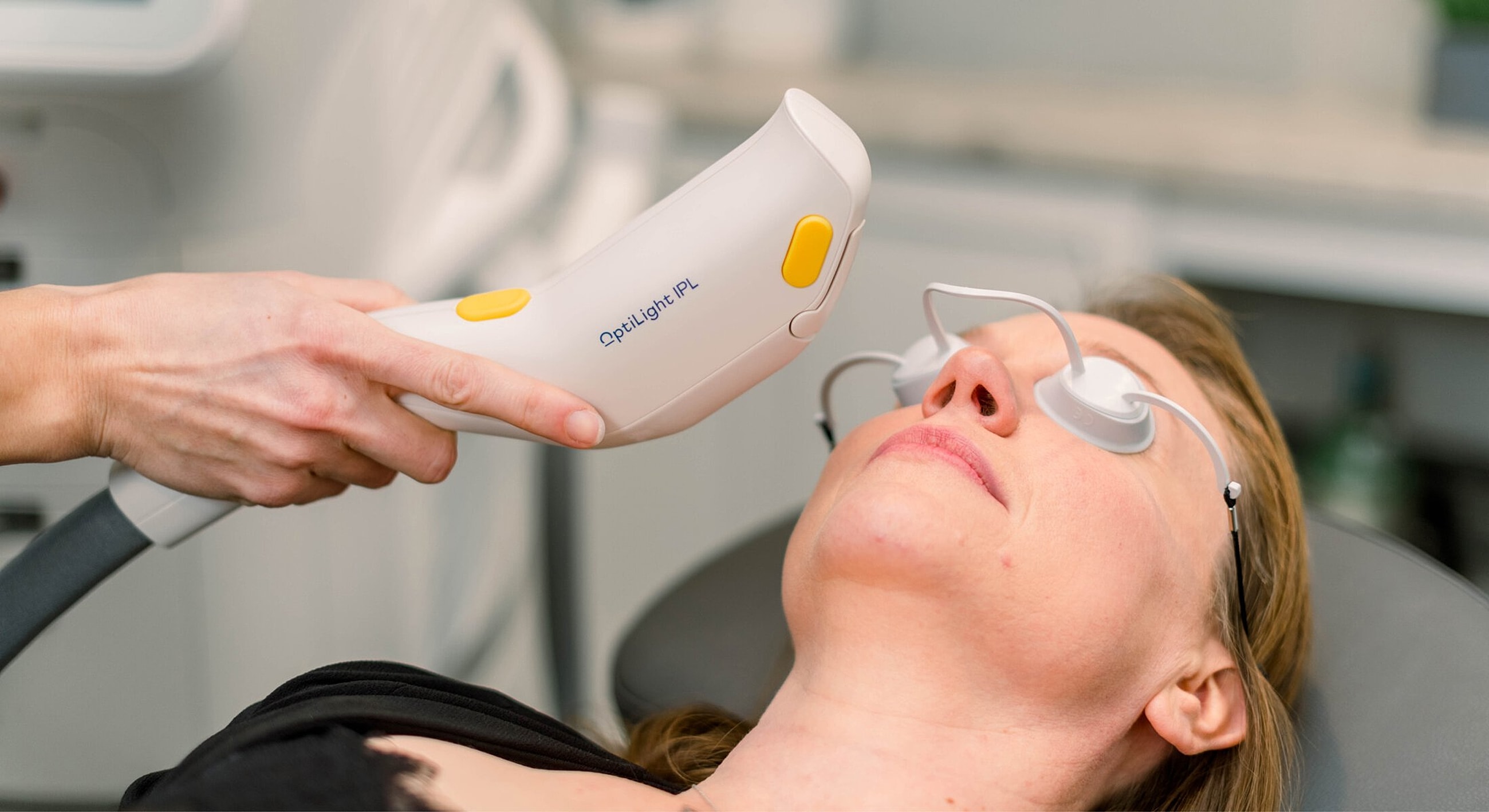 Woman receiving IPL treatment for skin care.