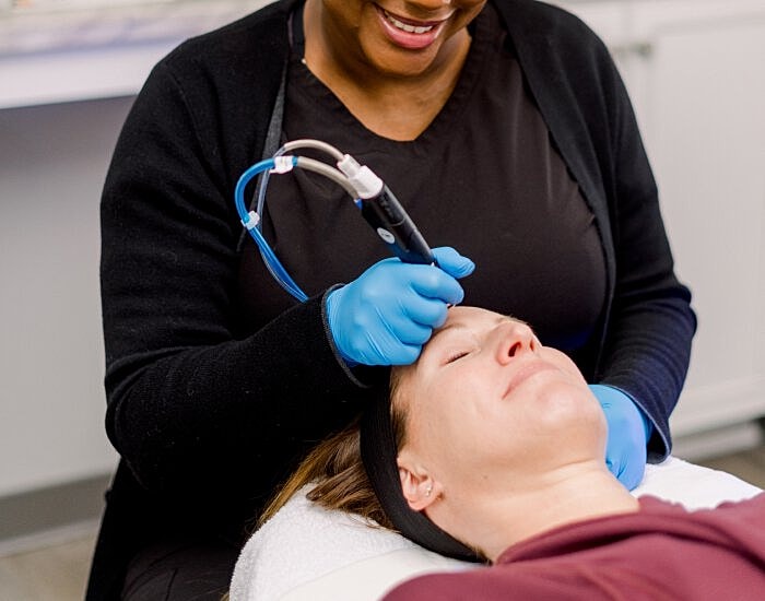 Laser treatment in a skincare clinic setting.