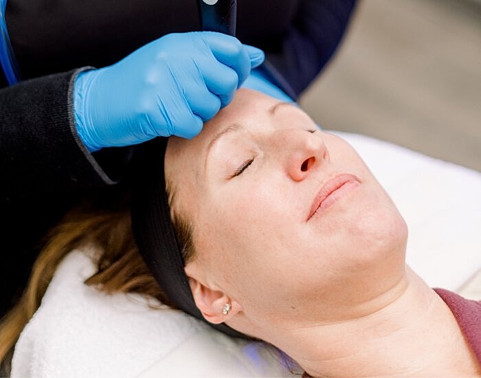 Facial treatment in progress at a spa.